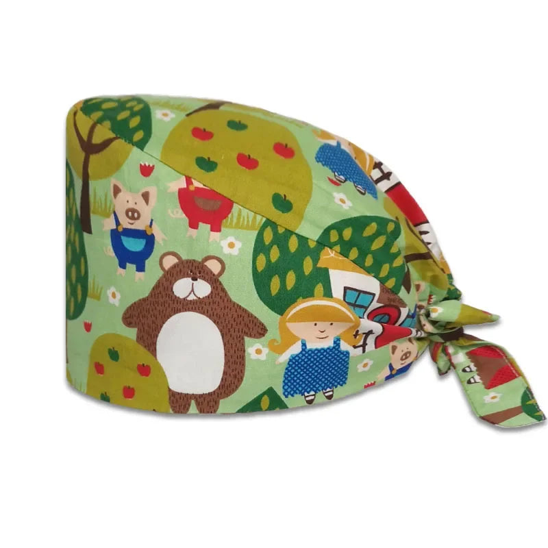 A printed cotton surgical cap featuring cute animal characters on a green background.