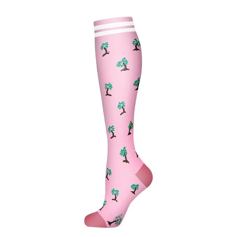 Pink compression socks with a tropical tree pattern