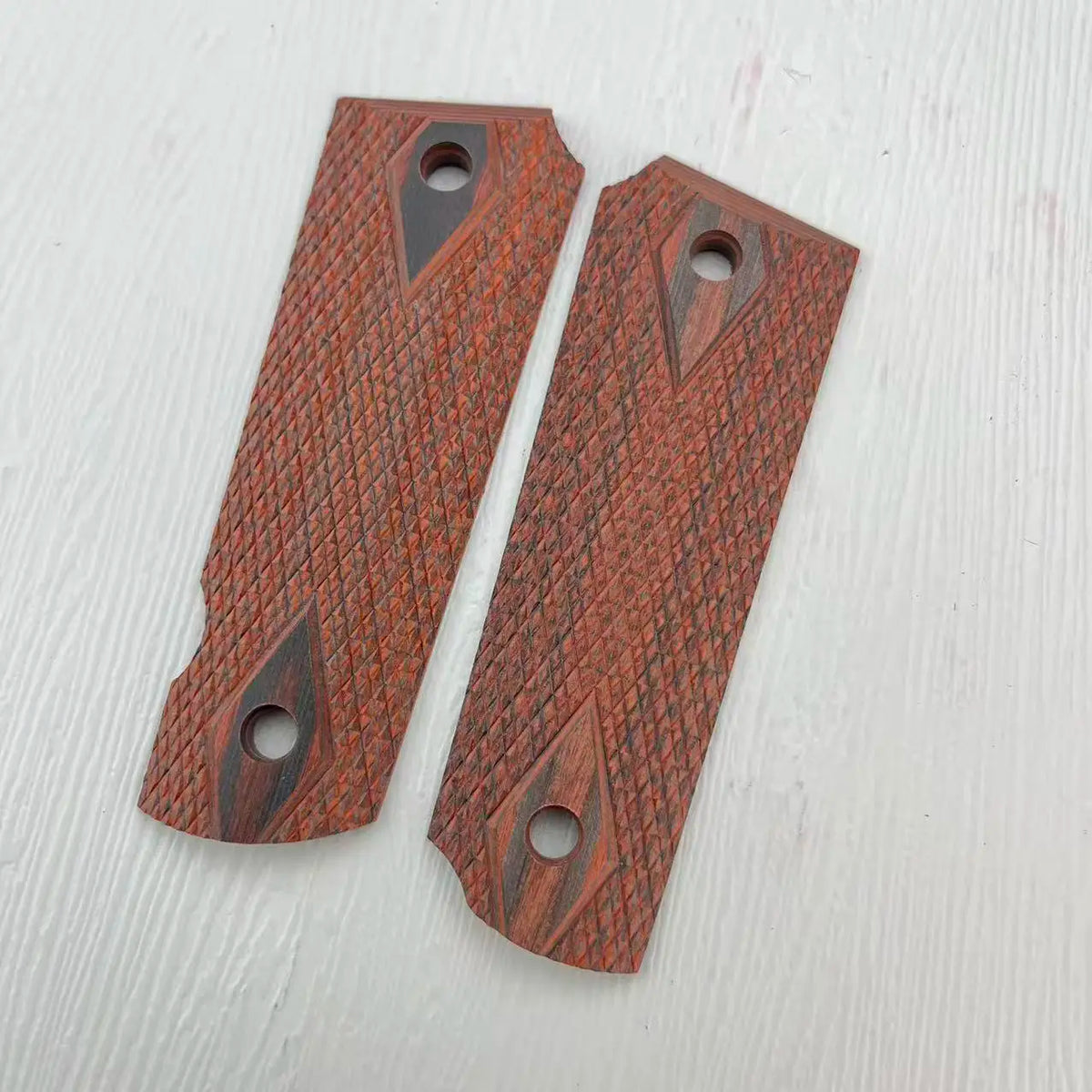 Two rosewood DIY knife grip patches with decorative patterns and holes