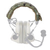 A tactical modular headset protection cover with a camouflage fabric headband and white earcups.