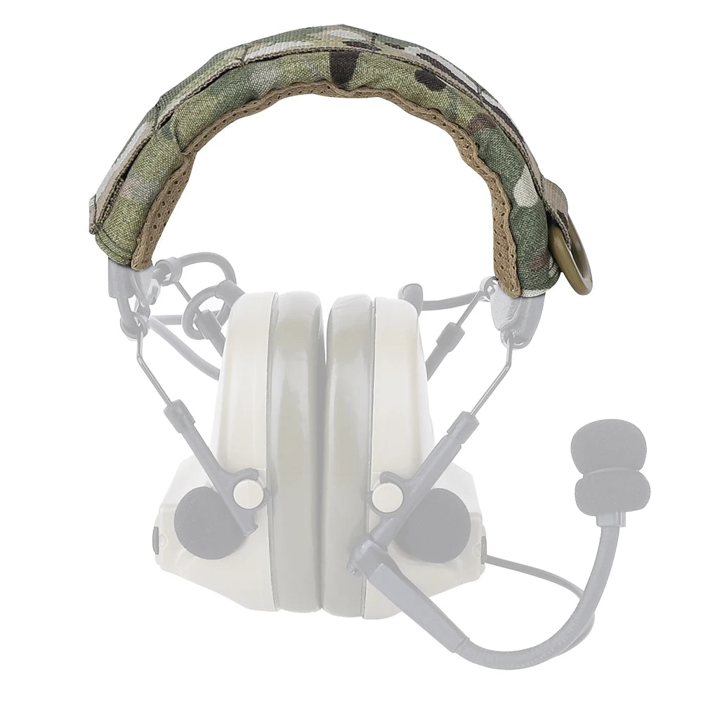 A tactical modular headset protection cover with a camouflage fabric headband and white earcups.