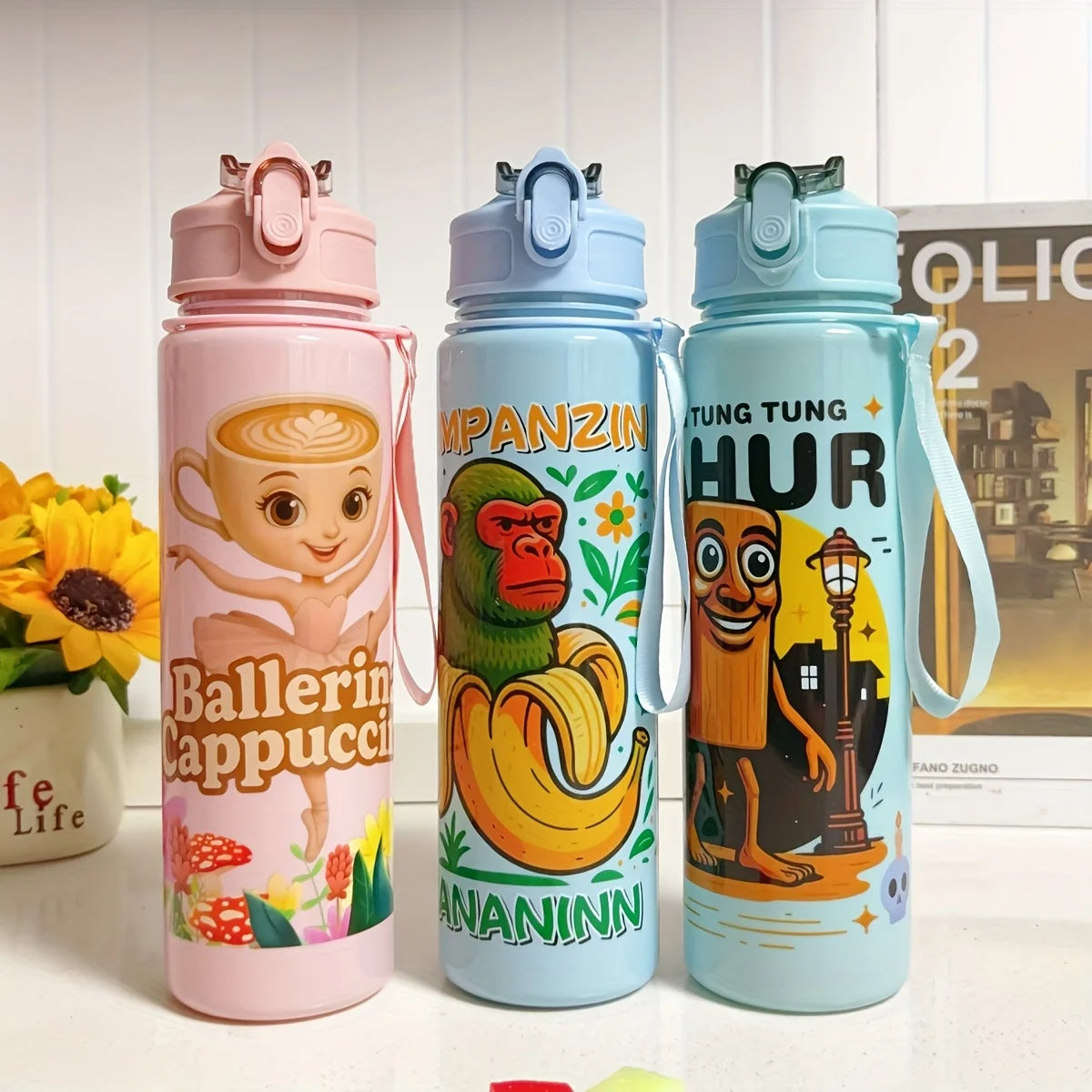 Three colorful insulated sports water bottles featuring characters like Ballerin Cappucci, Pampzin, and Hur.
