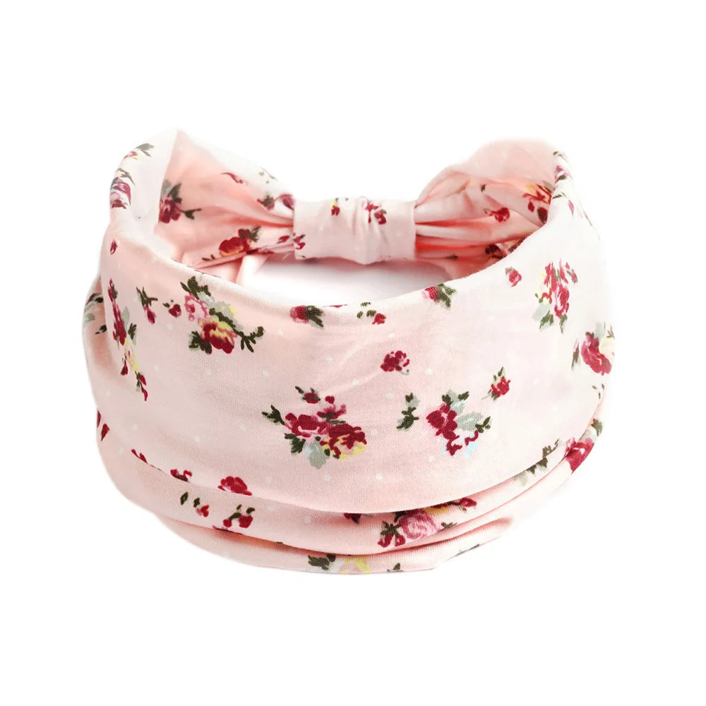 Pink floral cotton stretch headband tied in a bow
