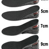 Un ensemble de semelles intérieures noires de différentes épaisseurs, allant de 3 cm à 9 cm.