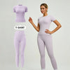Model in a lilac sports suit with short-sleeved top and matching leggings.