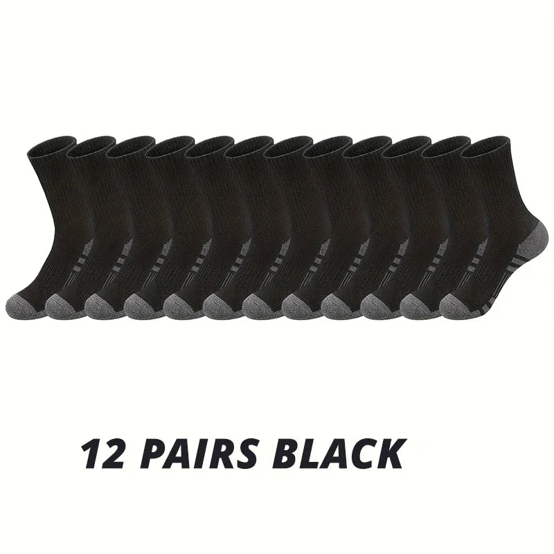 Twelve pairs of black men's outdoor gym football socks laid out in a row.