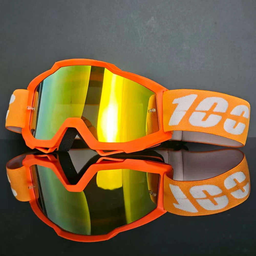 Gafas de motocross naranjas con lentes tintados en amarillo y marca blanca
