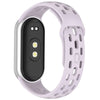 A light purple silicone smart watch band replacement with a black display and textured strap.