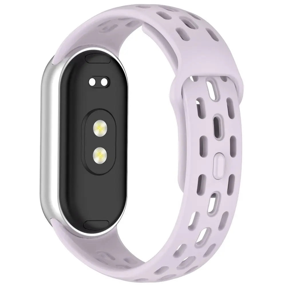 A light purple silicone smart watch band replacement with a black display and textured strap.