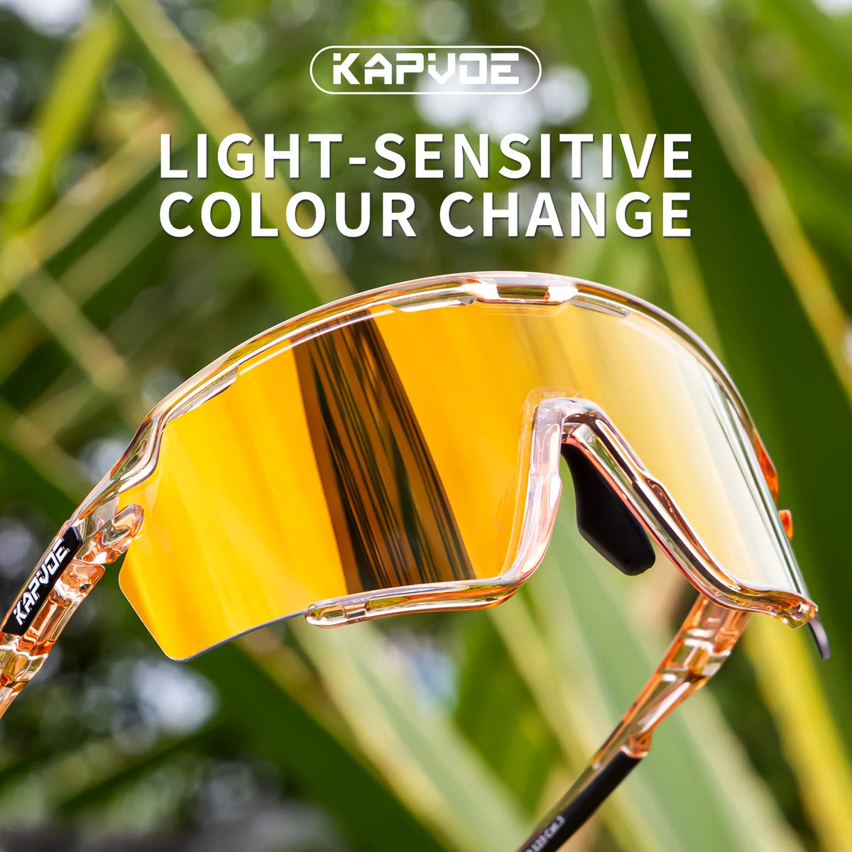 A pair of yellow-tinted photochromic cycling sunglasses are shown in bright outdoor lighting.