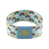A colorful stretch wristband bracelet featuring rainbow and sun patterns on a light blue background.