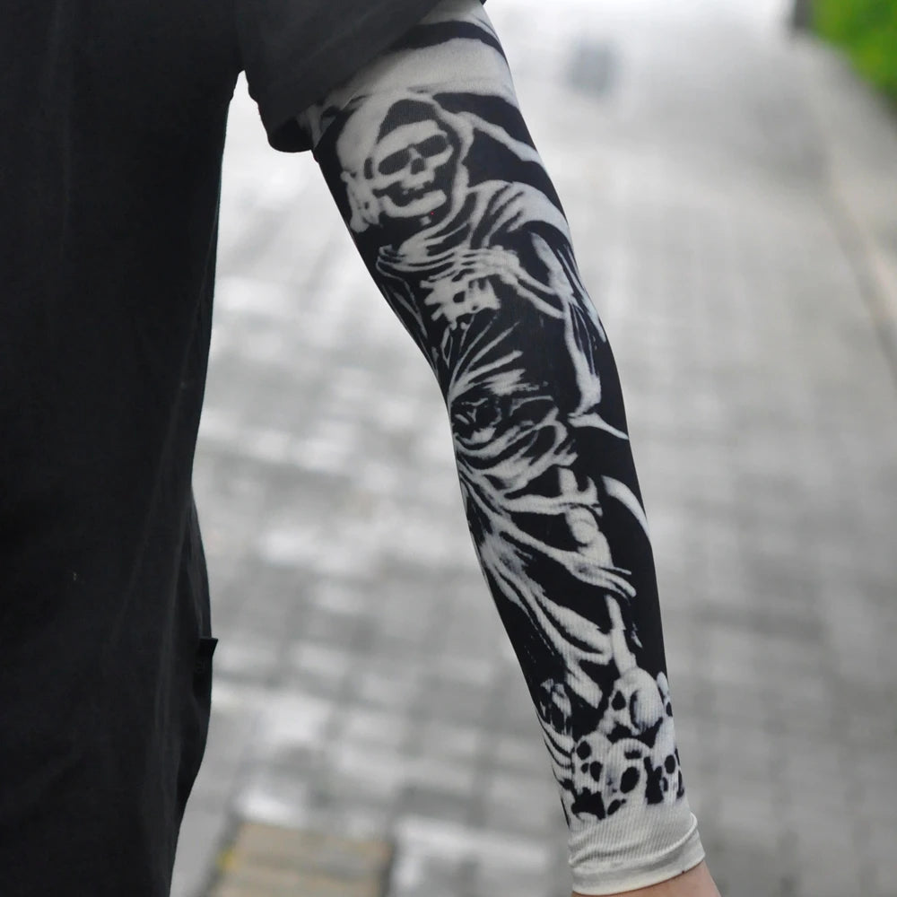 Black leg featuring a white skull and bone tattoo sleeve on the lower leg.