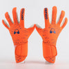 Pair of bright orange Defigo goalkeeper gloves with black speckles