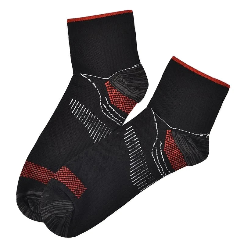 A pair of black ankle compression socks with red accents, shown from the side.