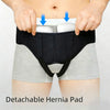 A black hernia belt is shown being worn over light gray shorts, with white compression pads visible on the abdomen.