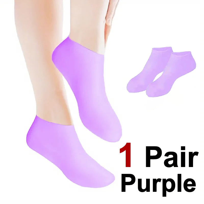 One pair of purple silicone moisturizing socks shown on a foot and separate for display.