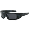 A pair of black camouflage polarized sunglasses with dark lenses and a matte finish.