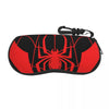 A black pouch with a red spider web design and a black strap.