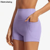 A model is wearing light purple high-waist yoga shorts, showing the fit and fabric.