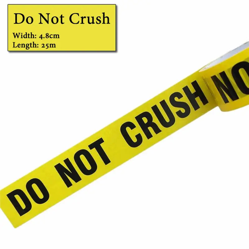Yellow industrial safety warning tape with black text DO NOT CRUSH NO visible on the roll.