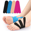 A set of colorful precut kinesiology tape strips for foot and joint support shown on a person's foot.