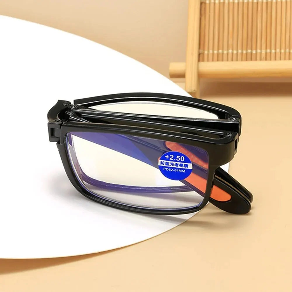 Black folding reading glasses with blue anti-blue light protection lens displayed on a white background.