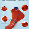 Orange performance socks displayed in various angles showing details like threaded openings and soft fabric texture.