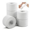 Rolls of white athletic training tape with a dispenser and hand applying the tape.