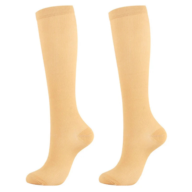 Pair of beige medical grade compression socks for veins and circulation