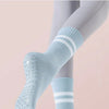 Light blue non-slip yoga socks with ribbed cuffs and perforated toes