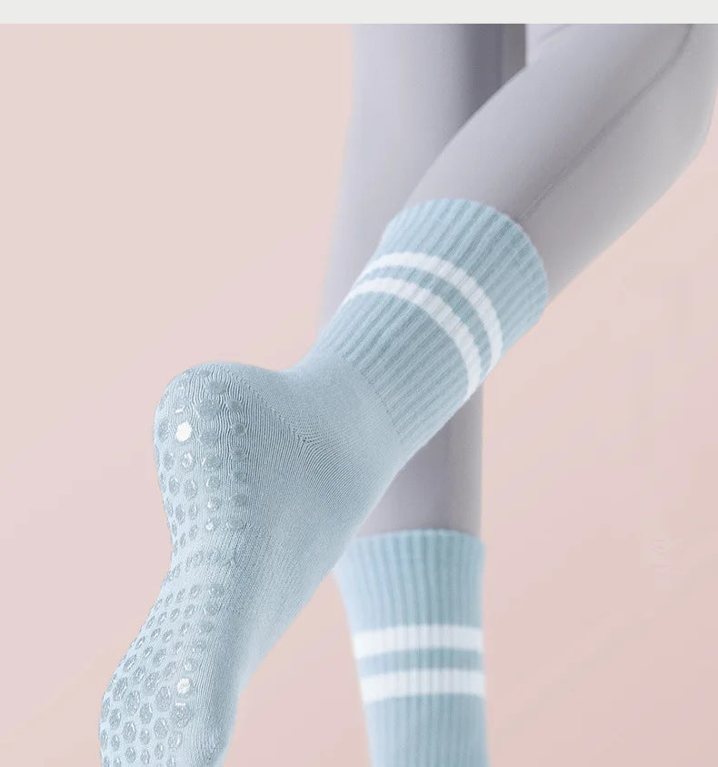 Light blue non-slip yoga socks with ribbed cuffs and perforated toes