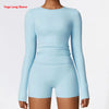 Light blue women's long sleeve yoga and fitness t-shirt worn by a model