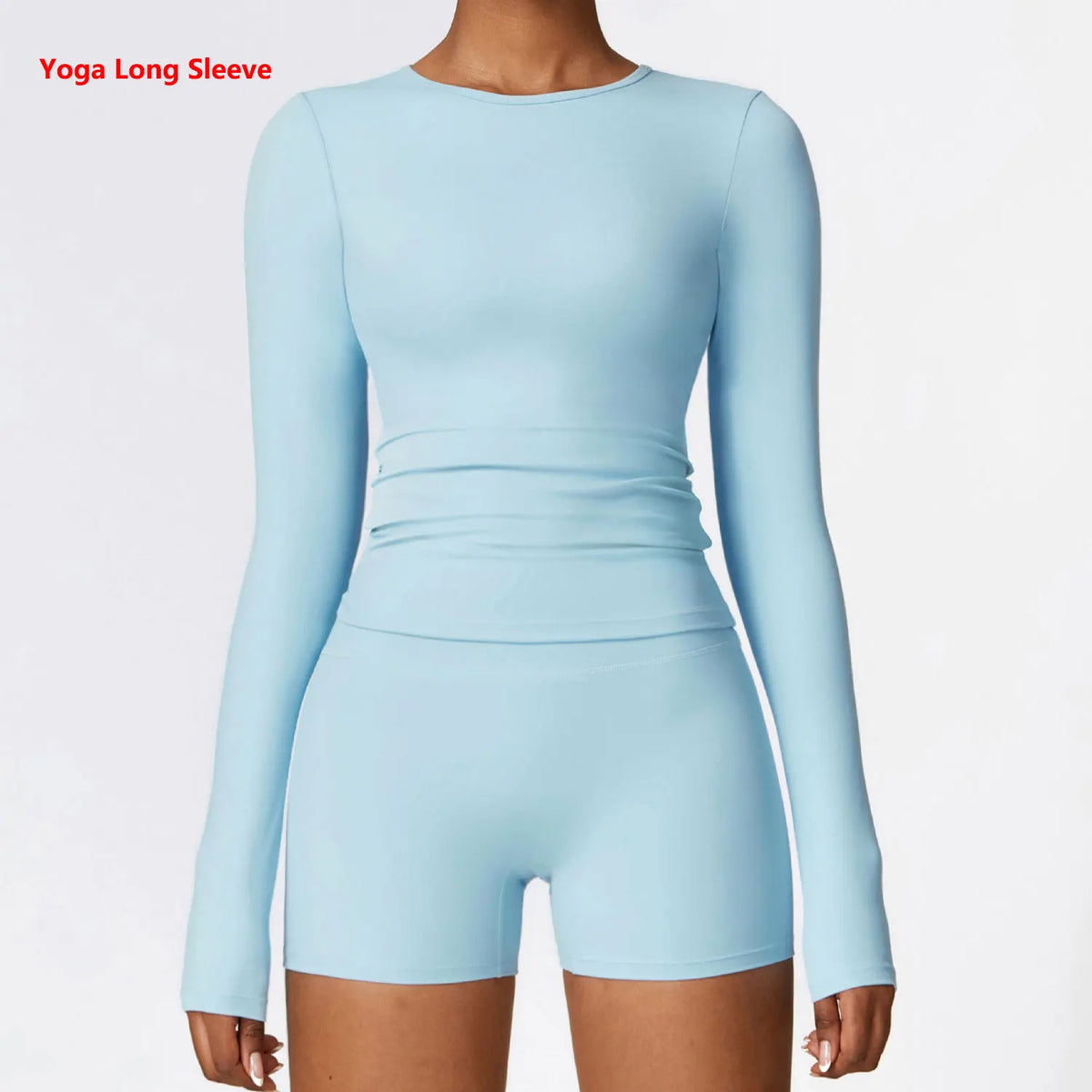 Light blue women's long sleeve yoga and fitness t-shirt worn by a model