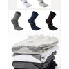 A collection of men's sport compression socks in various colors and patterns, including gray, black, navy blue, and white.
