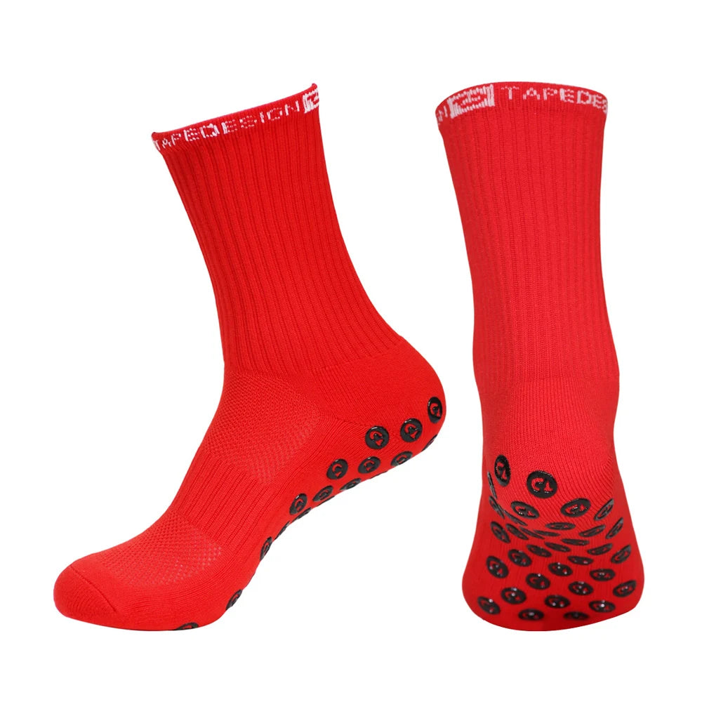 A pair of red performance sports gripping socks shown against a white background.
