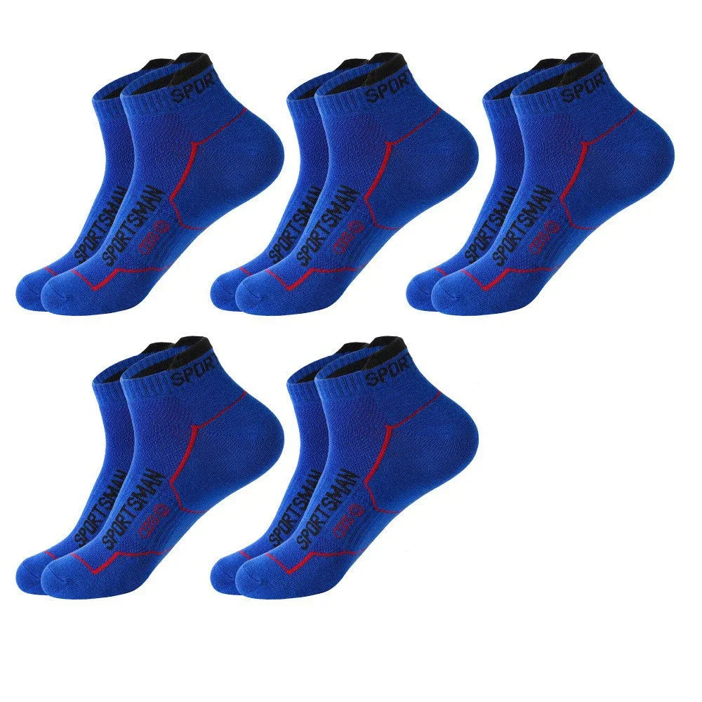 A pack of five blue sports socks with red accents shown from the side.