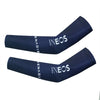 A pair of dark blue cycling arm warmers featuring the INEOS logo on the sleeve.