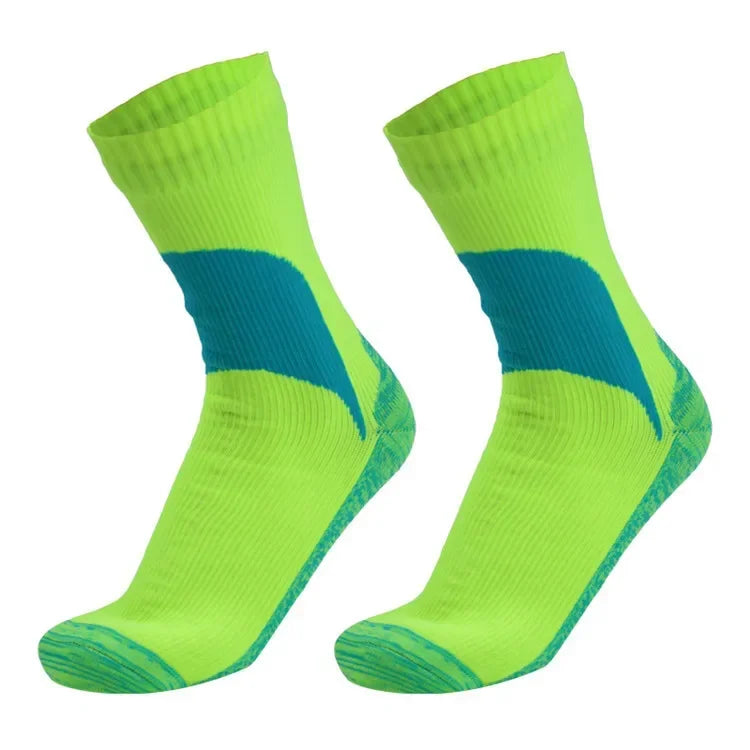 A pair of neon yellow hiking socks with a blue stripe detail.