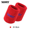 A pair of red knitted sport wristbands shown against a white background.