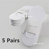 Five pairs of white invisible silicone no-show boat socks stacked on a white box.