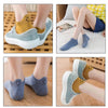 A collection of embroidered ankle socks in various colors and styles shown on feet.