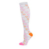 A pair of white compression socks with pink heart patterns and an orange toe section.
