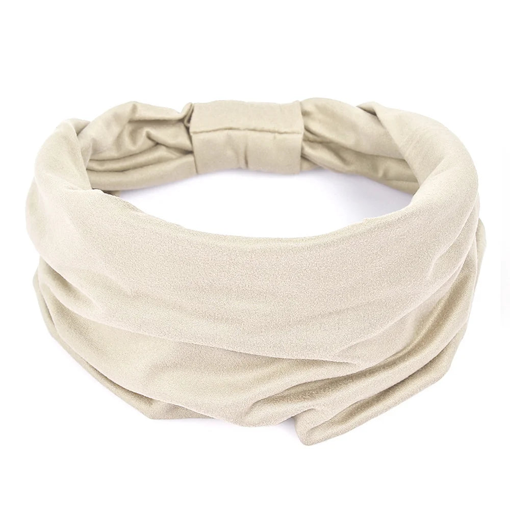 A beige non-slip elastic headband tied in a bow, suitable for fitness or hair