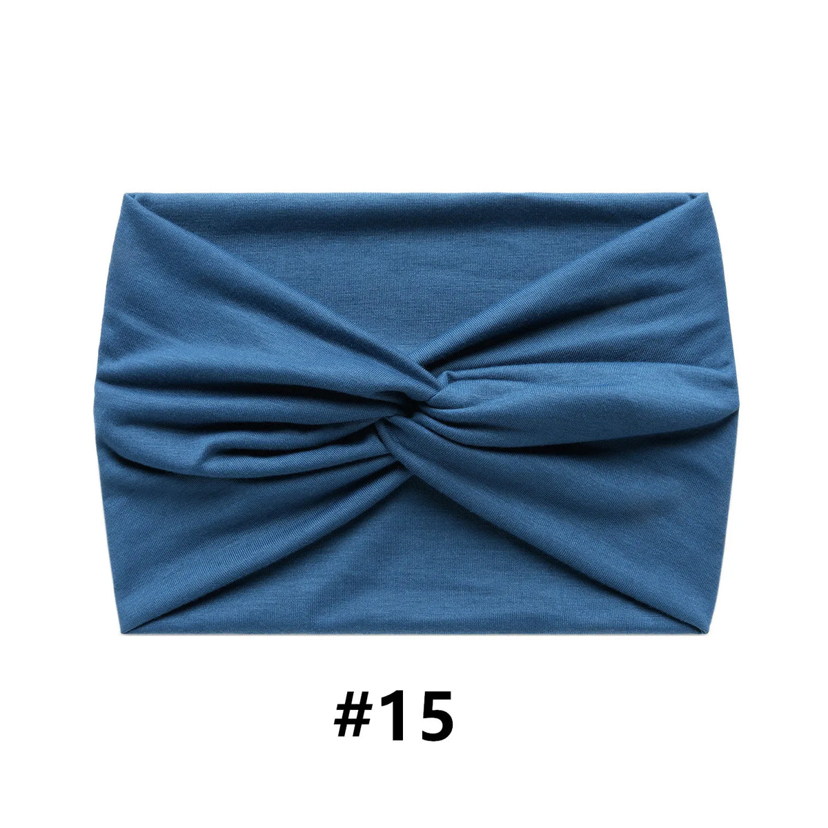 A folded navy blue fabric item, likely a boho wide turban headband.