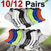 A collection of 10 pairs of multi-colored athletic socks displayed in a row on a surface.