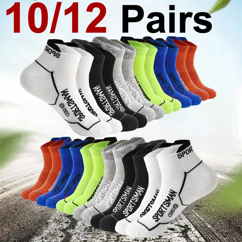 A collection of 10 pairs of multi-colored athletic socks displayed in a row on a surface.