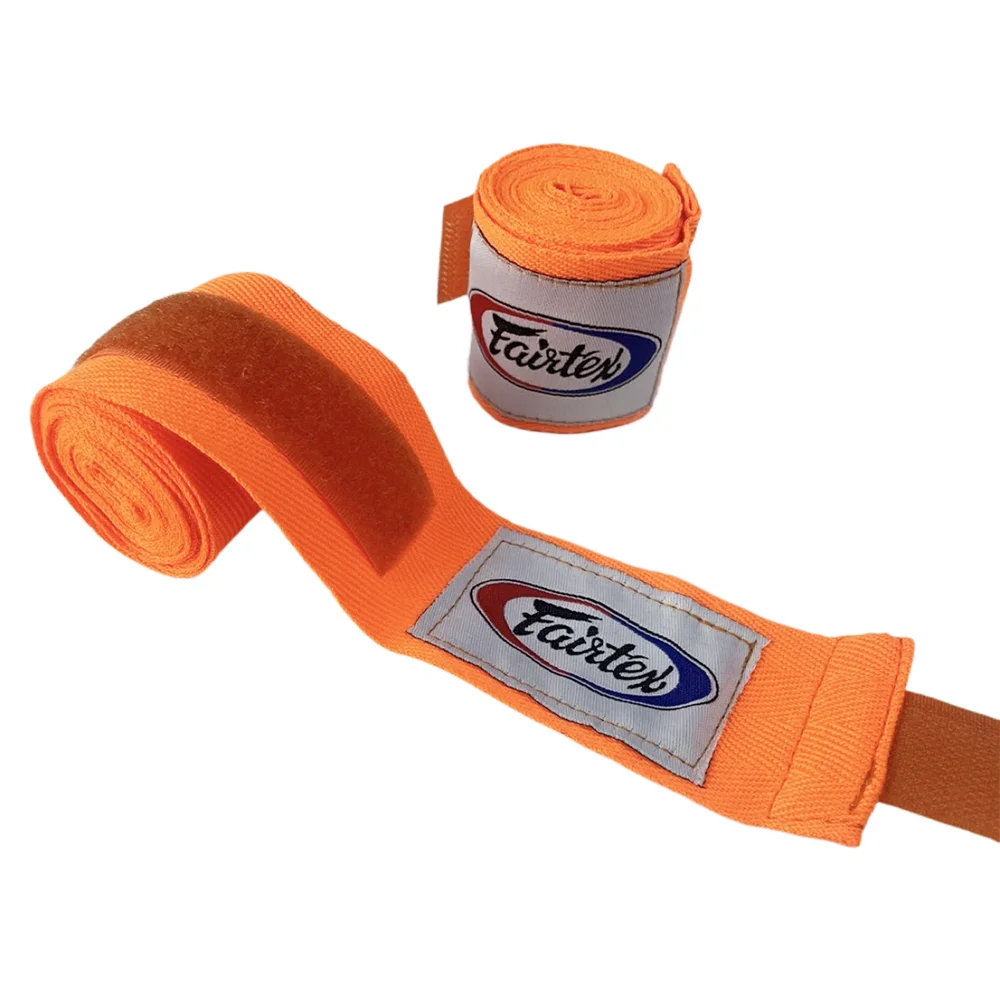 Orange boxing hand wraps rolled and unrolled, showing the Fairtex logo on the fabric.