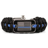Black paracord survival bracelet with a silver buckle and an American flag charm.