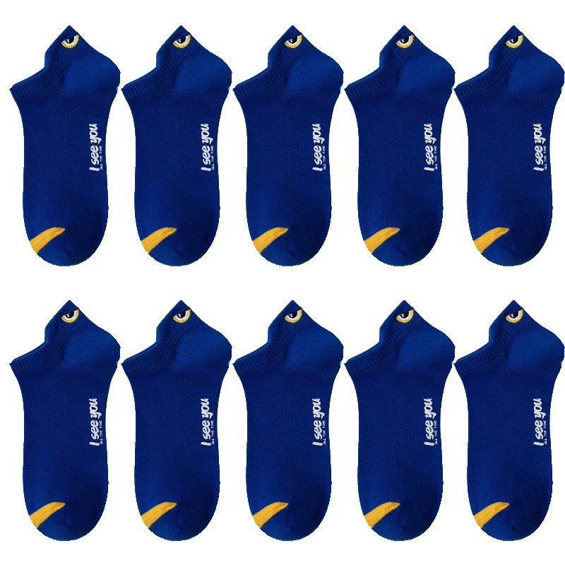 A set of dark blue men's breathable ankle boat socks with yellow accents.