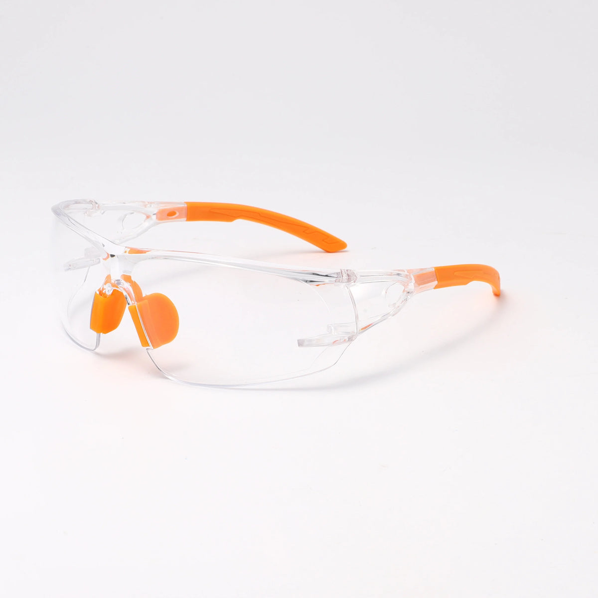 Transparent safety goggles with orange frames and lenses for outdoor and work use